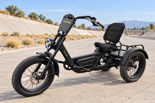 FlekTrike Pro All-Terrain Tilting eTrike with electric trike hydraulic disc brakes on an open concrete promenade.
