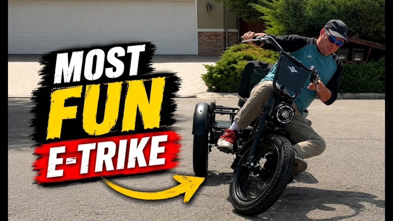 A man wearing a cap and sunglasses rides a black three-wheeled electric tricycle in a driveway. Large text on the left reads 'MOST FUN E-TRIKE' with a yellow arrow pointing toward the vehicle.
