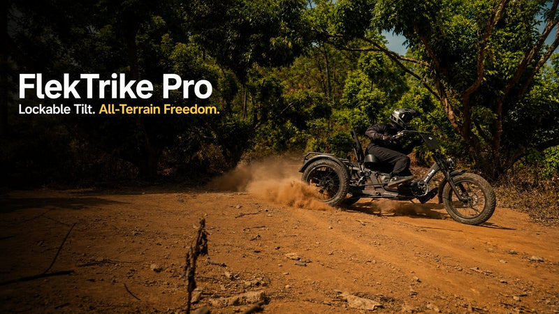 Rider on flektrike pro cornering on a dirt road in a wooded terrain