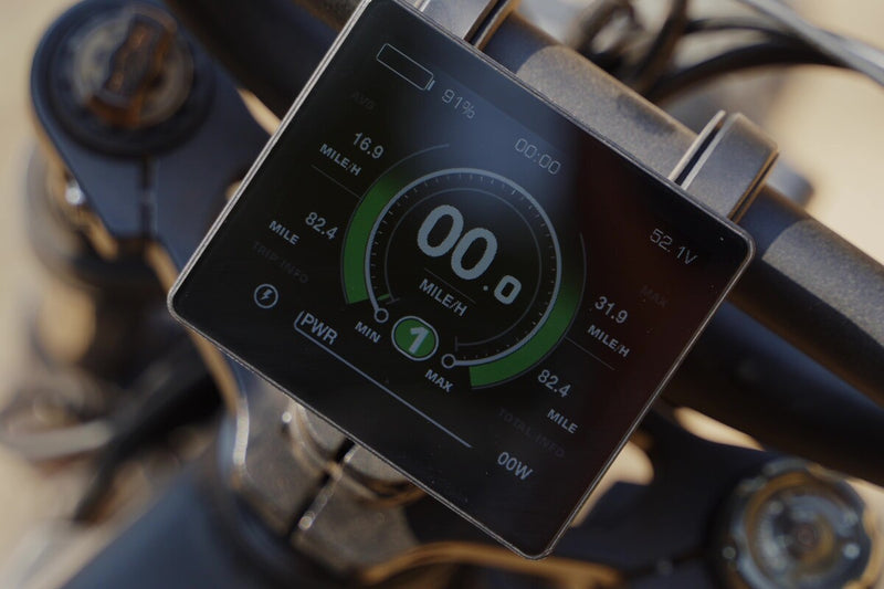 Close-up of a digital display on a flektrike swing with various metrics.