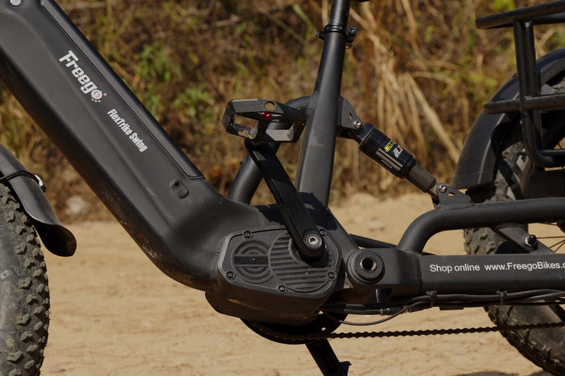 Close-up of a flektrike swing with visible branding on a natural background