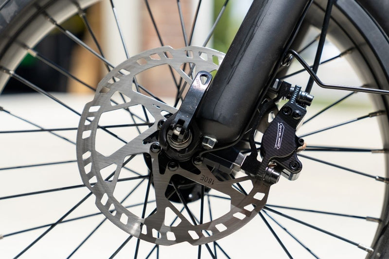 Close-up of the hydraulic disc brake
system on the FlekTrike Pro All-
Terrain Tilting eTrike.