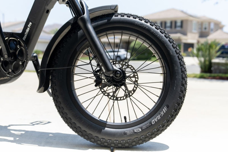 Close-up of the tire on the FlekTrike Pro All-Terrain Tilting eTrike.