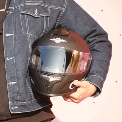Freego California helmet held by rider, front view