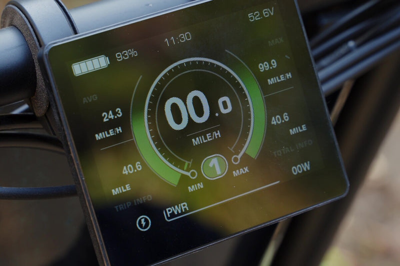 Digital display of a flektrike pro showing battery level, speed, and other metrics.